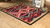 Rustic Cross Black Southwestern Rug - 5 x 8